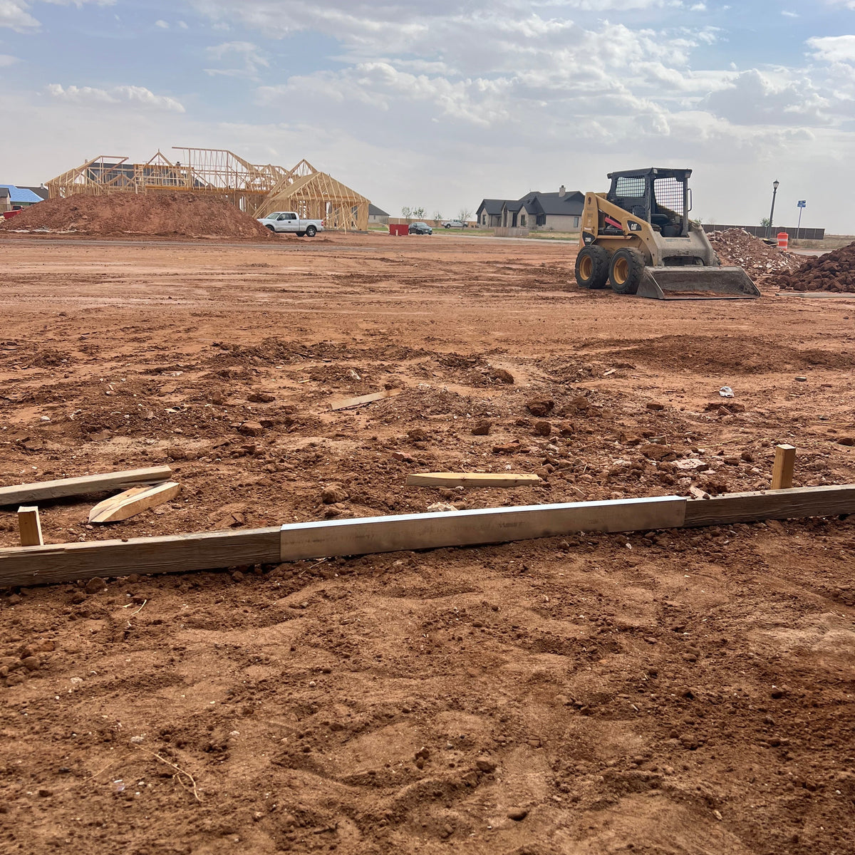 FormExtender Ultimate Kit in use on wooden concrete forms at a jobsite